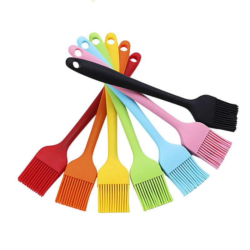 Set of colorful silicone basting brushes on a white background