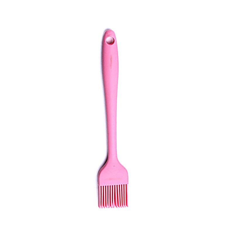 Pink barbecue brush with a white background