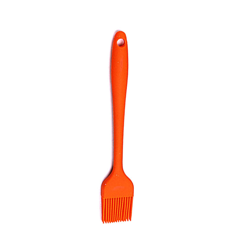 Orange basting brush on a white background