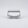 Stainless steel garlic press with dimensions and packaging details on a white background