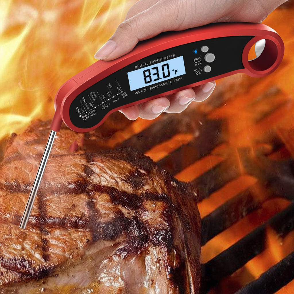Digital thermometer being used to check the temperature of a grilled steak with flames in the background.