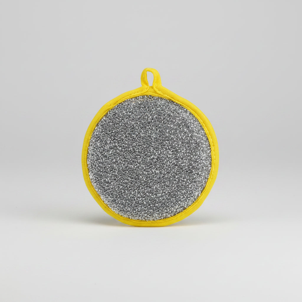 Round metallic scrubber with yellow handle on a white background